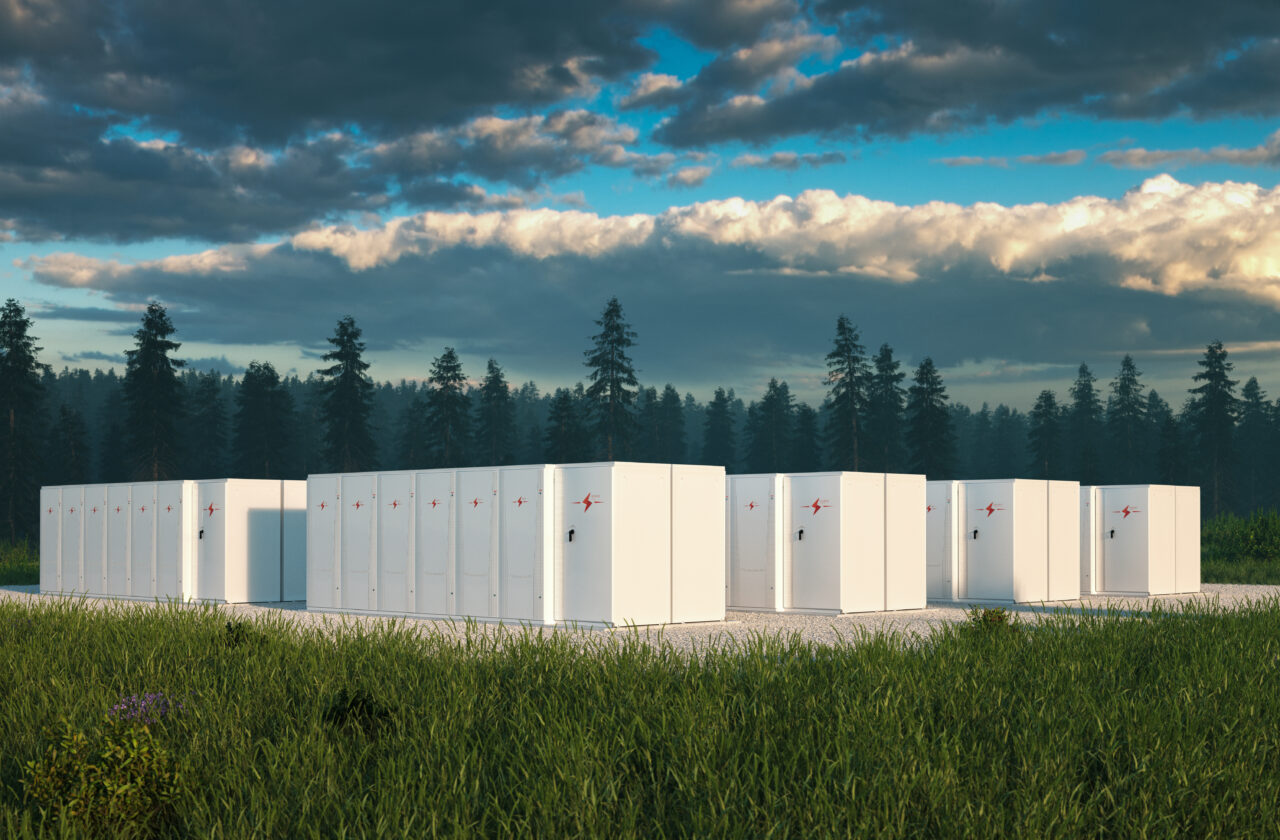 Eco friendly battery energy storage system in nature with misty forest in background and fresh grassland in foreground. 3d rendering.
