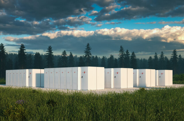 Eco friendly battery energy storage system in nature with misty forest in background and fresh grassland in foreground. 3d rendering.